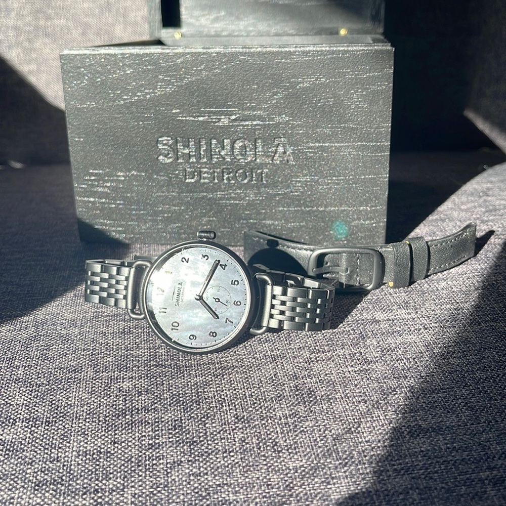 All black Shinola watch with mother of pearl background